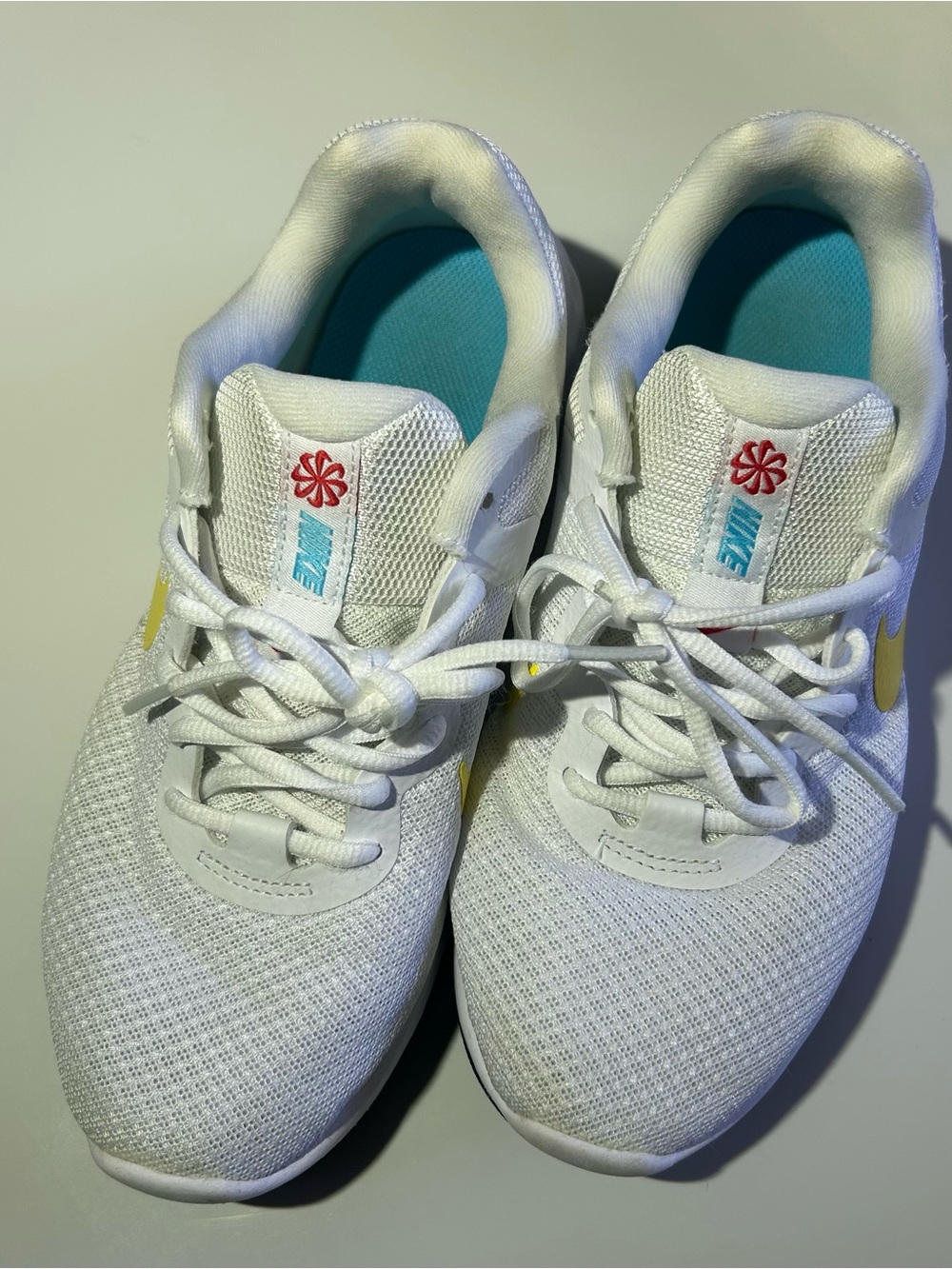 Nike women’s 7.5 Revolution 6 White Sneakers with Yellow Swoosh